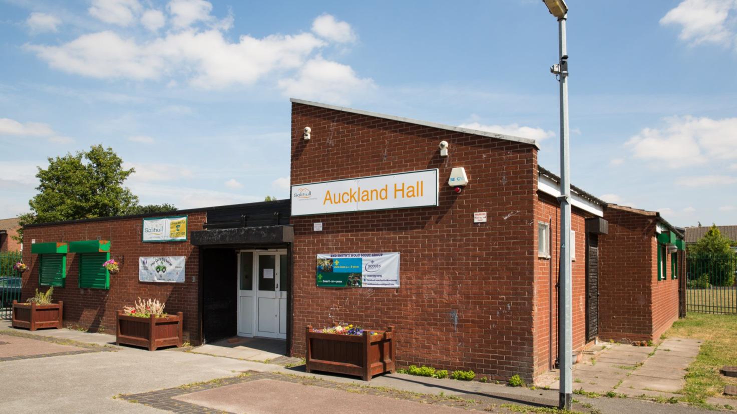 Red-brick building with a sign reading 'Auckland Hall'.