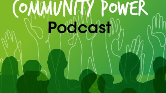 A graphic with a lime green background, a row of shadow outlines of people takes up the bottom half, white outlines of hands waving in the air are illustrated behind, and across the top reads the words 'The community power podcast'.