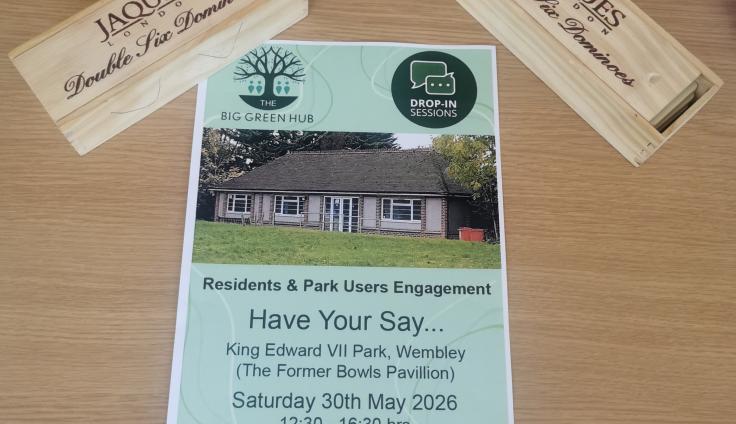 A green poster with writing that says 'The Big Green Hub; Have Your Say'