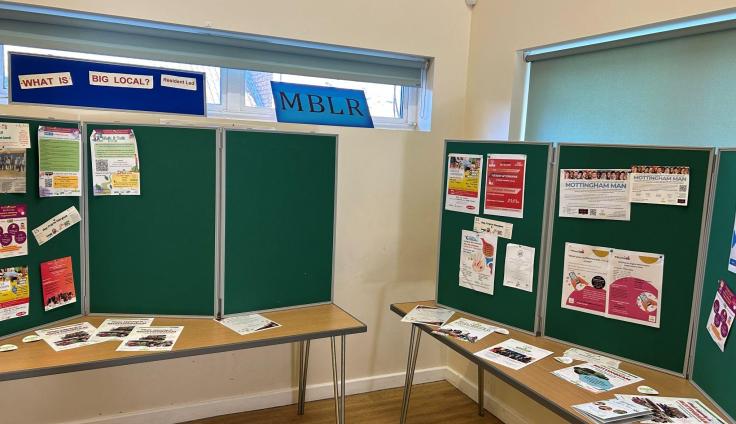 Display boards covered with posters and images.