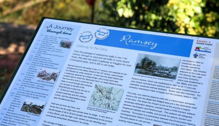 Close-up of a an information board reading 'Ramsey: Open for Discovery'
