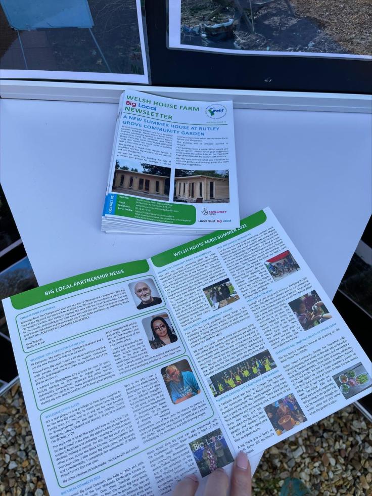 An open A4 newsletter showing text and colourful photographs.
